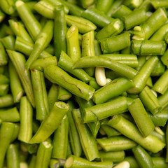 Harvest of green beans from the garden as a background