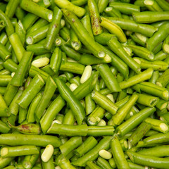 Harvest of green beans from the garden as a background