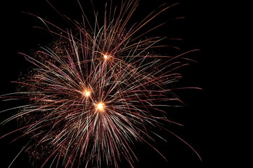 Fototapeta premium red and yellow fireworks isolated against dark sky