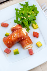 rolls of tuna with crab meat on the plate