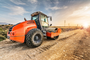 Steamroller performing work prior to the asphalting of a road