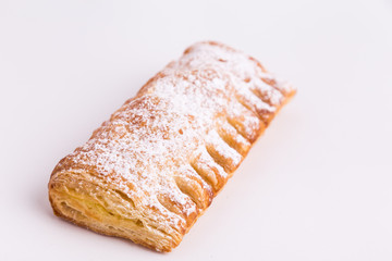 cream cane cake, with sugar on white background