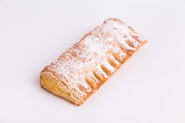 cream cane cake, with sugar on white background