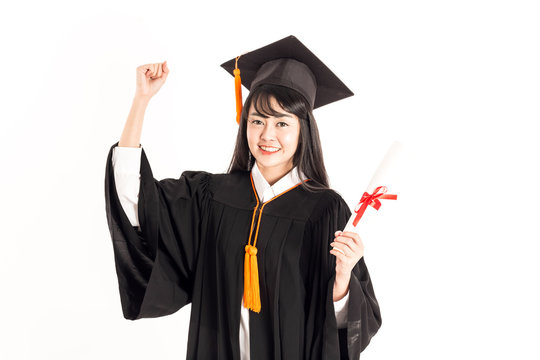 Beautiful Attractive Asian woman graduated in cap and gown smile with certificated in her hand feeling so proud and happiness,Isolated on white background,Education Success Concept