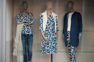 closeup of winter clothes on mannequin in fashion store showroom for women