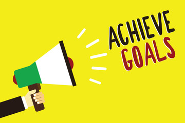 Text sign showing Achieve Goals. Conceptual photo Results oriented Reach Target Effective Planning Succeed Man holding megaphone loudspeaker yellow background message speaking loud