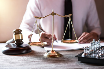 Legal law, advice and justice concept, Professional male lawyers working on courtroom sitting at...