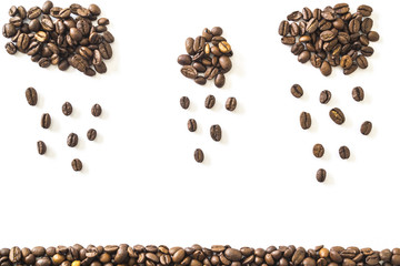 Grains of coffee laid out in the form of clouds and rain.