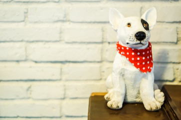 A Cute toy dog tie red scarf.