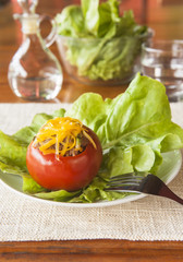 Tomato Stuffed with Beef and Vegetables Topped With Cheese
