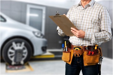 Auto Repair Shop, Male Mechanic near Car