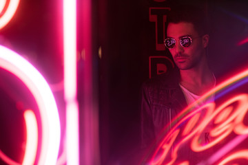 Modern handsome man with sunglasses and leather jacket 