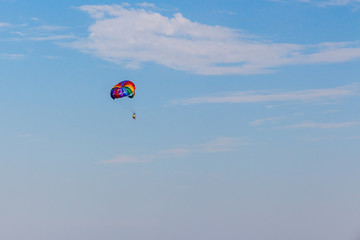 multicolored parachute in blue sky