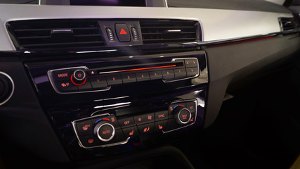 A modern multimedia car panel with various indicators