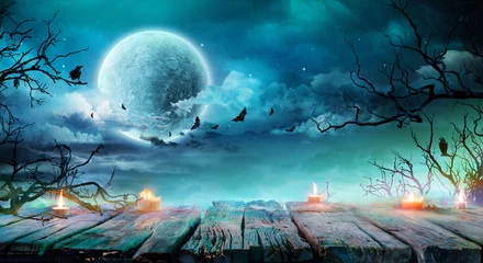 Foto op Plexiglas Halloween Achtergrond - Oude Tafel Met Kaarsen En Takken Op Griezelige Nacht Met Volle Maan © Romolo Tavani