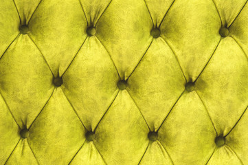 Velor surface of sofa close-up. Training equipment-velor mats tightened with buttons. Yellow...