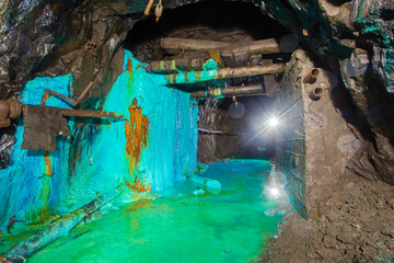 Underground abandoned gold iron ore mine shaft tunnel gallery passage with timbering wooden amazing...