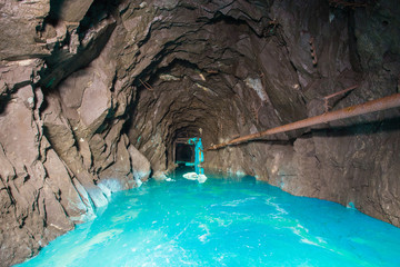 Underground abandoned gold iron ore mine shaft tunnel gallery passage with timbering wooden amazing...