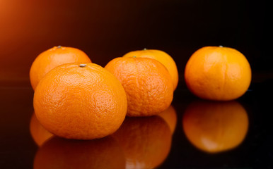 Orange fruit  in black background.