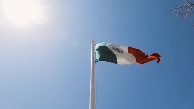 Mexican Flag waving in slowmotion on a sunny day in Cabo Close Up