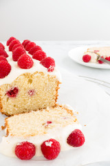Homemade Raspberry Loaf Cake decorated with Raspberries