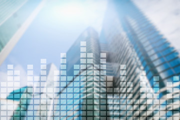 Financial chart on blurred skyscraper office background.