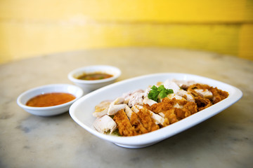 The fried chicken in a dish with cucumber,  eat with rice as foods that are beneficial to the body, Fast Food commonly eaten in the countries of Thailand