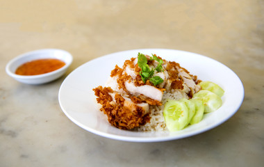 The fried chicken in a dish with cucumber,  eat with rice as foods that are beneficial to the body, Fast Food commonly eaten in the countries of Thailand