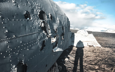 The abandoned DC-3 Airplane on Solheimasandur beach. Airplane wreckage on black sand beach. Douglas...