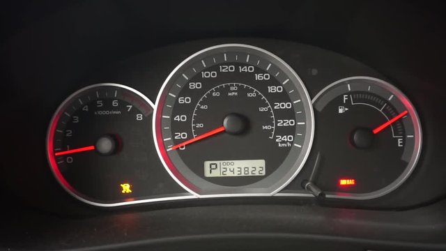 A car starts and needles move on dashboard.