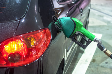 detail of a car being fueled with ethanol in a gas station in Sao Paulo