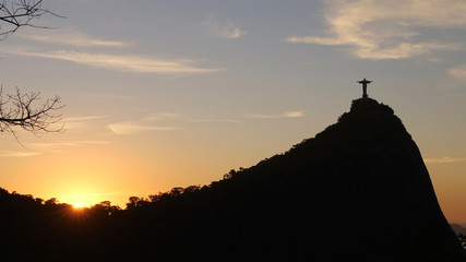 Fototapeta premium Christ the Redeemer statue on top of Corcovado, Rio de Janeiro, Brazil on sunset.