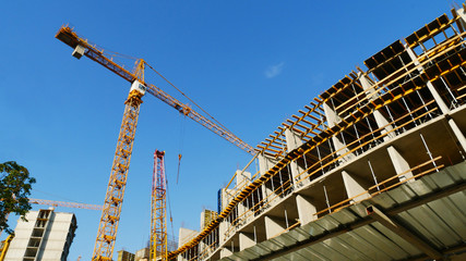 Naklejka premium Construction site. Crane near concrete building.