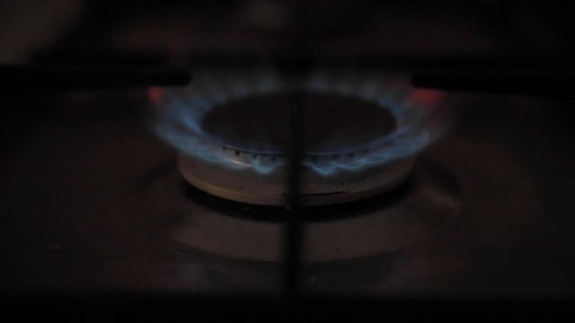 Ignition of the gas stove in the afternoon before cooking in slow motion