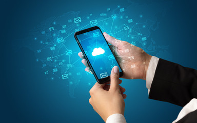 Female hand using smartphone with cloud, message and global concept
