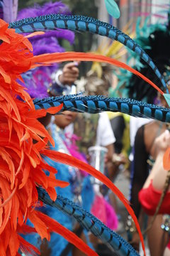 NOTTING HILL, LONDON - AUGUST 27, 2018: Notting Hill Carnival, Long Feathers On Headpiece Worn By Woman In The Parade.