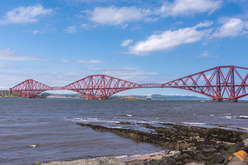 Queensferry, Scotland, UK - June 14, 2012: Closeup of Red metal iconic Forth Bridge for trains over...