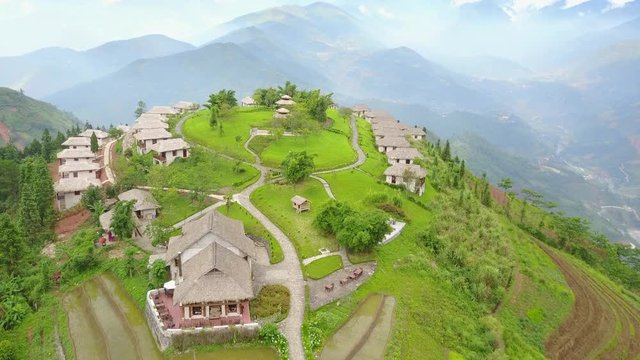 4k Aerial: Flying over Hilltop Bunglows surrounded with Rice Fields of Sapa, Vietnam