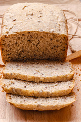 Sliced wholemeal bread on cutting board
