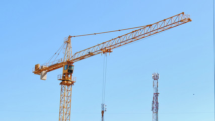 Crane against blue sky.