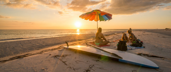 LOVERS KEY, FORT MYERS BEACH, FLOIRDA/USA 11/4/15: Girlfriends enjoying the sunset on the beach...