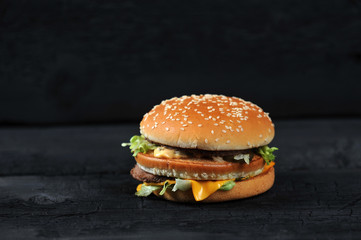 fresh tasty burger on black