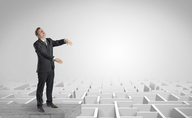 Zombi elegant businessman on the top of a labyrinth
