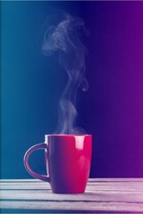 Red hot cup of coffee on black background