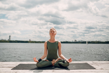 Fototapeta na wymiar Young woman doing yoga practice