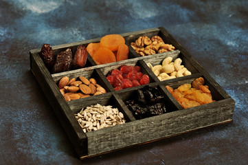 dried fruits and nuts in a wooden box