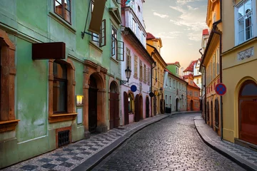 Zelfklevend Fotobehang Narrow street in Prague © Givaga