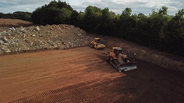 Caterpillar D6 Dozer pushing earth.