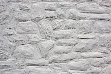 Hintergrund – alte verputzte  Natursteinmauer