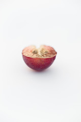 Close-up of half cut red grape with seeds and endosperm